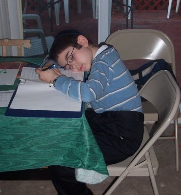 Menasheh Yoseif, asleep on his homework